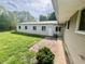 View of the outbuilding with the adjacent grass and walkway at 1927 E 125 S, Franklin, IN 46131
