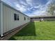 Side view of the outbuilding in the backyard with ample green space at 1927 E 125 S, Franklin, IN 46131