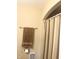 A bathroom features a shower with curtain and towel rack at 1927 E 125 S, Franklin, IN 46131