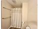 Neutral toned bathroom featuring a shower with curtain and basic toilet at 1927 E 125 S, Franklin, IN 46131