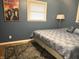 Cozy bedroom with neutral blue walls and hardwood floors offers a relaxing atmosphere at 1927 E 125 S, Franklin, IN 46131