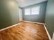 A bedroom with hardwood floors, natural light, and a closet at 1927 E 125 S, Franklin, IN 46131