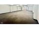 Large open room with bare carpet at 1927 E 125 S, Franklin, IN 46131
