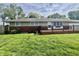 Ranch-style home featuring brick accents, a wooden deck, and a well-maintained green lawn at 1927 E 125 S, Franklin, IN 46131