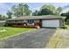 Charming single-story home featuring a spacious front deck, a convenient garage, and a well-paved driveway at 1927 E 125 S, Franklin, IN 46131