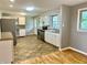 Updated kitchen with stainless steel appliances, white cabinets, and granite countertops at 1927 E 125 S, Franklin, IN 46131