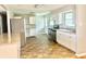 Modern kitchen with stainless steel appliances, white cabinets, and neutral backsplash at 1927 E 125 S, Franklin, IN 46131