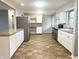 A spacious kitchen with white cabinets, stainless steel appliances and granite counter tops at 1927 E 125 S, Franklin, IN 46131