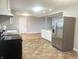 A kitchen with stainless steel refrigerator and views into another room at 1927 E 125 S, Franklin, IN 46131