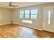 Bright living room featuring wood floors, large windows, and a neutral color scheme at 1927 E 125 S, Franklin, IN 46131