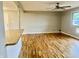 Inviting living room with hardwood floors, neutral paint, and a view into the kitchen area at 1927 E 125 S, Franklin, IN 46131