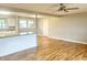 Hardwood floors connect kitchen and living space with natural light and fresh paint at 1927 E 125 S, Franklin, IN 46131