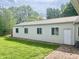 Exterior view of a metal outbuilding with adjacent grass and a brick walkway at 1927 E 125 S, Franklin, IN 46131