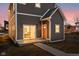 Back porch featuring a sliding glass door, orange door, and stylish chairs at 2024 Yandes St, Indianapolis, IN 46202