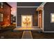 Back porch with a sliding glass door, orange door, and outdoor dining visible through glass at 2024 Yandes St, Indianapolis, IN 46202