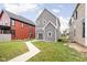 Backyard featuring a gray house with a patio and green lawn at 2024 Yandes St, Indianapolis, IN 46202