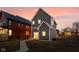 Backyard featuring a gray house with a patio and an adjacent red house at 2024 Yandes St, Indianapolis, IN 46202
