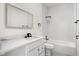 Bright bathroom featuring a white vanity, updated fixtures, and a tiled shower-tub combo at 2024 Yandes St, Indianapolis, IN 46202