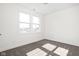Bright bedroom featuring neutral carpet, base trim and a window at 2024 Yandes St, Indianapolis, IN 46202