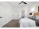 Bright bedroom with large windows, neutral carpet, ceiling fan, and adjacent bedroom entry at 2024 Yandes St, Indianapolis, IN 46202