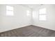 Bedroom with carpet, white walls, base trim and three windows at 2024 Yandes St, Indianapolis, IN 46202
