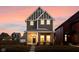 Striking two-story home boasts gray siding and vertical accents, with a covered porch and welcoming entrance at 2024 Yandes St, Indianapolis, IN 46202