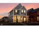 Beautiful two-story home with a charming front porch and modern design elements at 2024 Yandes St, Indianapolis, IN 46202
