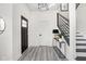 Bright foyer with modern lighting, stylish staircase, and elegant decor at 2024 Yandes St, Indianapolis, IN 46202