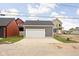 Detached two-car garage with a large concrete driveway and modern design at 2024 Yandes St, Indianapolis, IN 46202