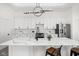 Modern kitchen features white cabinets, quartz countertops, stainless steel appliances, and stylish lighting at 2024 Yandes St, Indianapolis, IN 46202