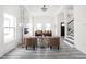 Bright living room with contemporary furniture, a fireplace, and staircase access at 2024 Yandes St, Indianapolis, IN 46202