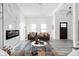 Well-lit living room featuring modern decor, a fireplace, and an open layout at 2024 Yandes St, Indianapolis, IN 46202