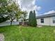 Spacious backyard with lush green lawn and landscaping, ideal for outdoor entertaining and Gathering enjoyment at 204 Meadow Creek S Dr, Whiteland, IN 46184