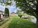 Picturesque backyard featuring a waterfront view, a shed, and a deck, perfect for outdoor enjoyment and relaxation at 204 Meadow Creek S Dr, Whiteland, IN 46184