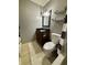 This bathroom has a wooden vanity and a black and white shower curtain at 204 Meadow Creek S Dr, Whiteland, IN 46184