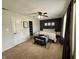 This bedroom has a ceiling fan, carpet, and an accent wall at 204 Meadow Creek S Dr, Whiteland, IN 46184