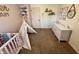 Cozy Bedroom showcasing a crib, teepee, white dresser, and carpeted floors at 204 Meadow Creek S Dr, Whiteland, IN 46184