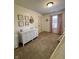 Neutral Bedroom with white dresser, soft carpet, and lavender curtains at 204 Meadow Creek S Dr, Whiteland, IN 46184