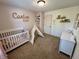 Adorable Bedroom featuring a white crib, teepee, and neutral carpet at 204 Meadow Creek S Dr, Whiteland, IN 46184