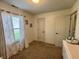 This room has a dresser and a window with patterned curtains at 204 Meadow Creek S Dr, Whiteland, IN 46184
