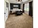 This bedroom has a ceiling fan, carpet, and an accent wall at 204 Meadow Creek S Dr, Whiteland, IN 46184
