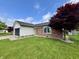 Well-kept home with a lush lawn and decorative trees providing beautiful curb appeal at 204 Meadow Creek S Dr, Whiteland, IN 46184