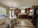 Inviting kitchen and dining area featuring stainless steel appliances and lovely wood cabinets at 204 Meadow Creek S Dr, Whiteland, IN 46184
