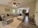 Open-concept living room showcasing stylish furniture and a smooth transition to the dining area and kitchen at 204 Meadow Creek S Dr, Whiteland, IN 46184