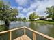 Beautiful view from a private wooden deck overlooking the tranquil pond, perfect for relaxation at 204 Meadow Creek S Dr, Whiteland, IN 46184