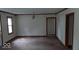 Spacious living room with neutral walls and natural light, ready for personalized updates at 2100 N Janney Ave, Muncie, IN 47304