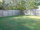 Large, well-maintained backyard with a wooden privacy fence creates a serene outdoor oasis at 2116 Galaxy Dr, Franklin, IN 46131