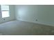 Bright bedroom featuring plush carpeting and ample natural light from a large window at 2116 Galaxy Dr, Franklin, IN 46131