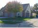 Charming home featuring a two-car garage, brick accents, and a well-manicured lawn with mature tree at 2116 Galaxy Dr, Franklin, IN 46131