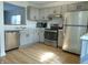 Well-equipped kitchen featuring gray cabinets, stainless steel appliances, and modern fixtures at 2116 Galaxy Dr, Franklin, IN 46131